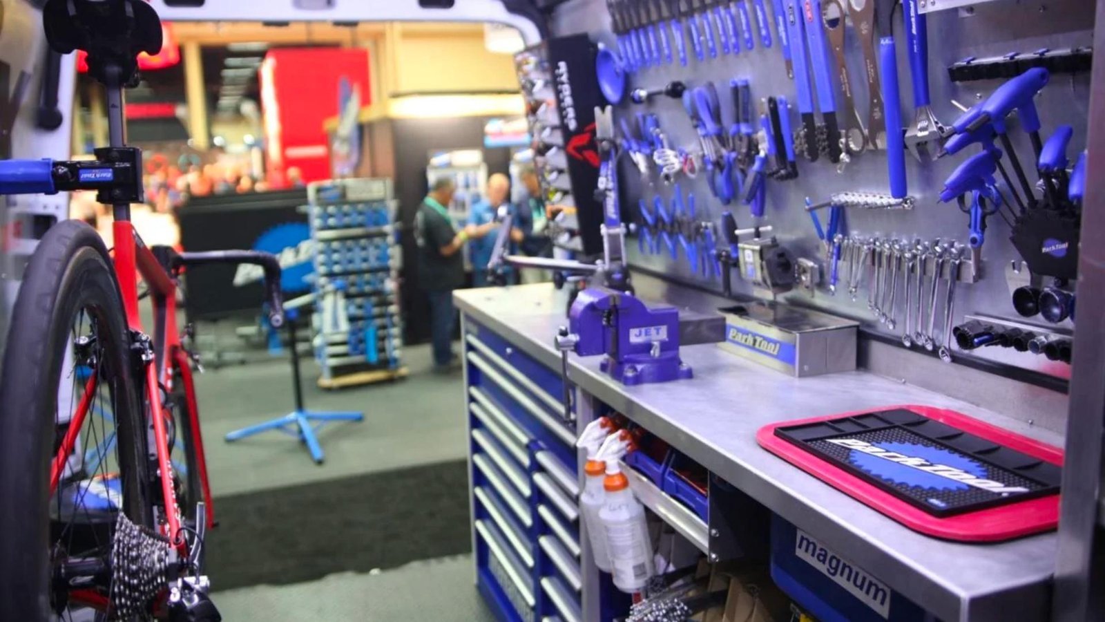A professional selection of essential bike shop tools arranged on a clean workbench.