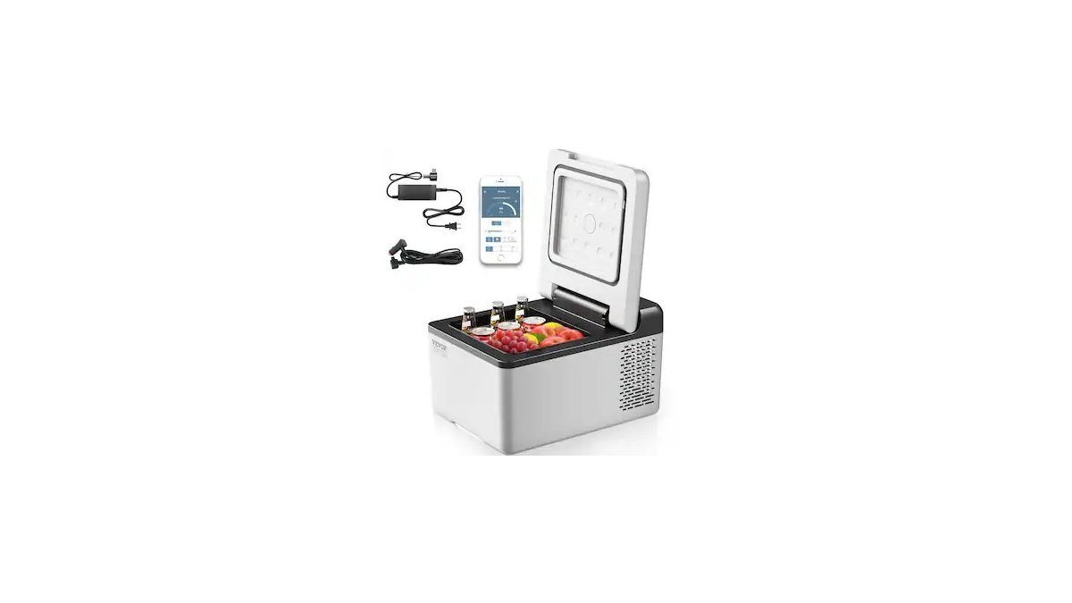 A portable car refrigerator filled with fresh drinks inside an open vehicle trunk.