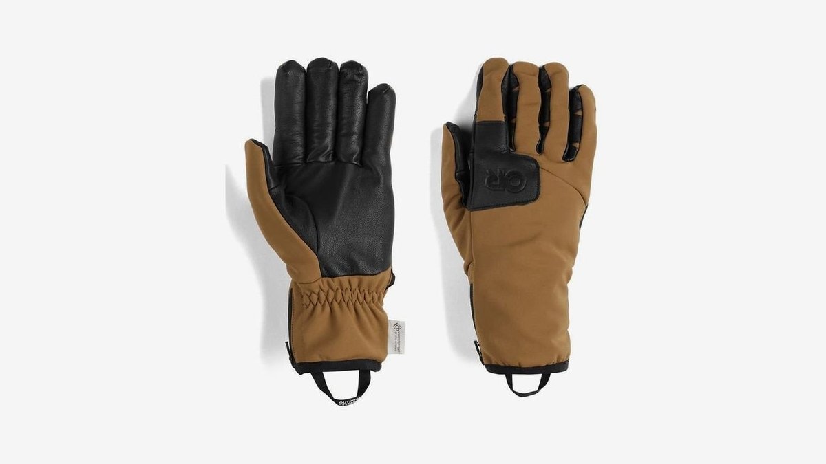 Premium men's cold weather gloves resting on a frosted bench in winter.