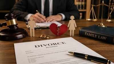 A stack of helpful books about divorce separation and family law on a desk.