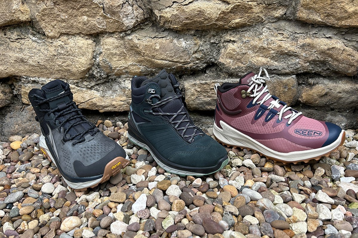 A pair of supportive hiking shoes for Morton's neuroma sits on a forest trail.