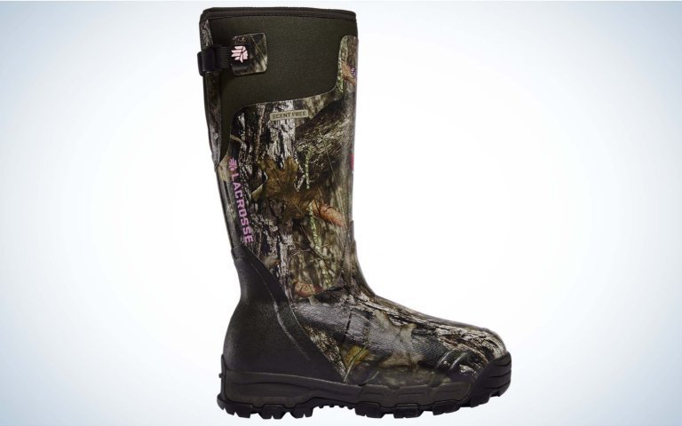 Durable insulated boots for men resting on the surface of a frozen lake.