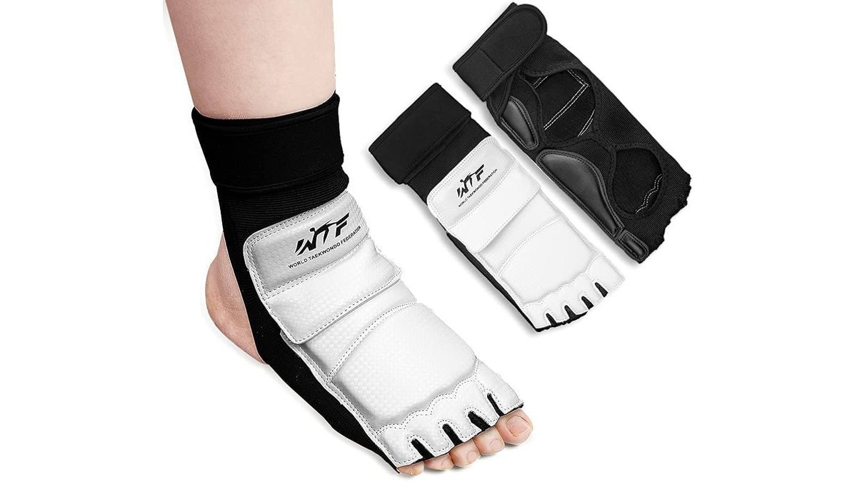 High quality martial arts protective foot gear displayed on a clean training mat.