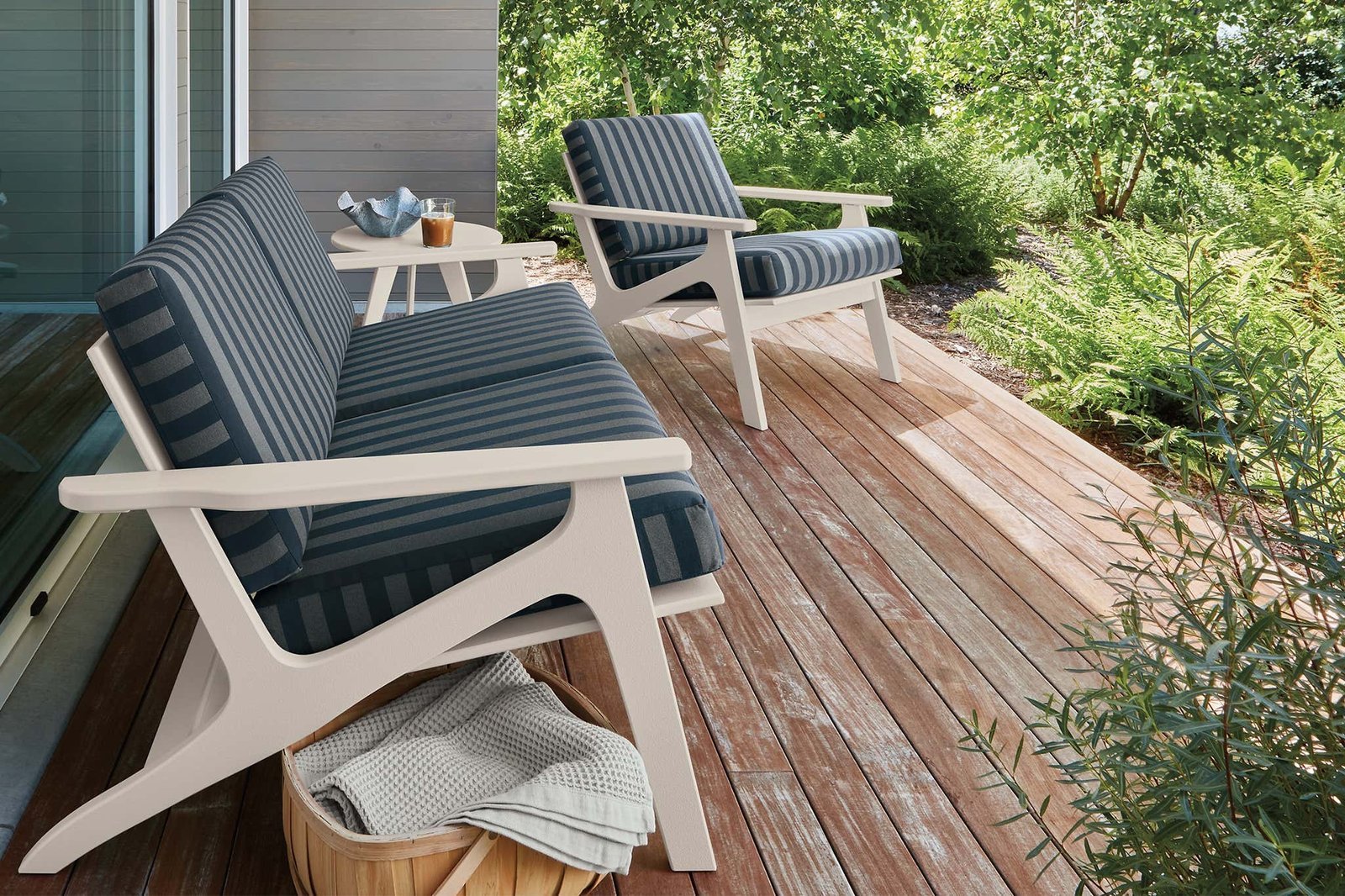 A luxurious outdoor sofa on a spacious patio perfect for large backyard living areas.