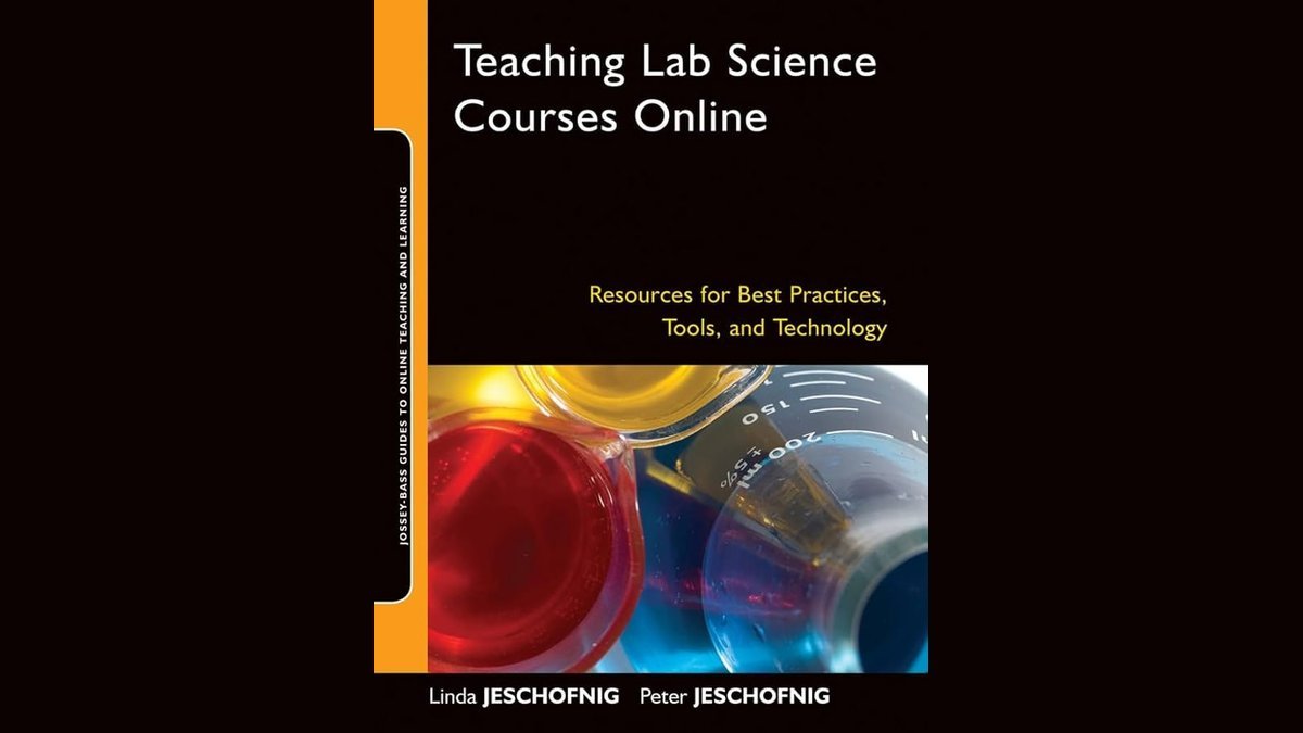 A variety of science and technology teaching materials books sit on a desk.