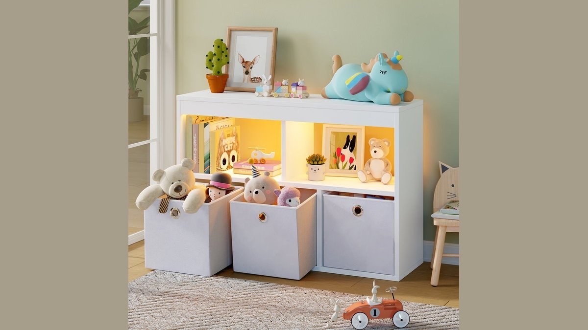 A modern toy storage organizer with drawers helps keep a playroom tidy and organized.