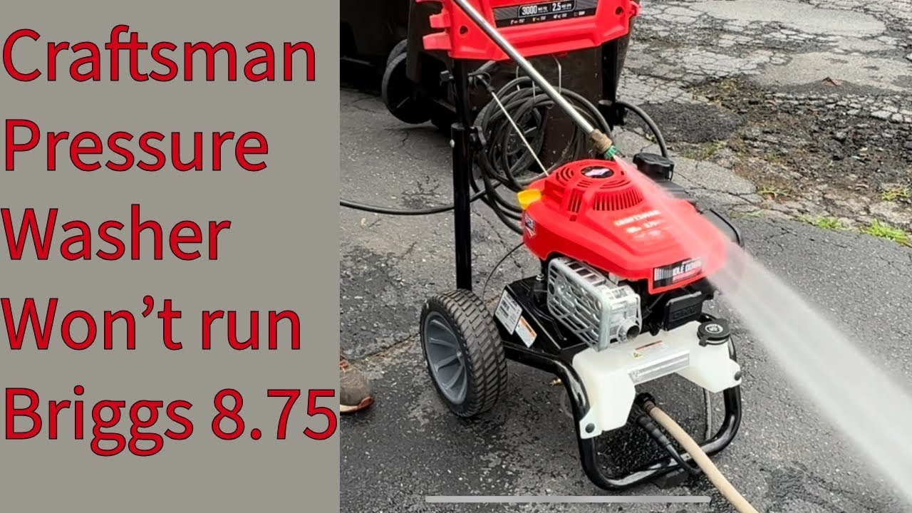 Inspecting the water intake connection on a Craftsman power washer for potential blockages.