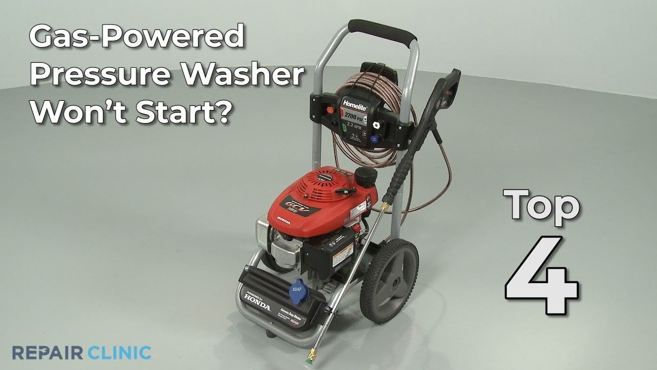 Cleaning a small power washer spray nozzle with a thin wire tool.