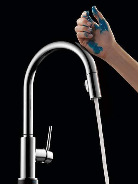 A tablet showing troubleshooting steps sits next to a chrome faucet component.