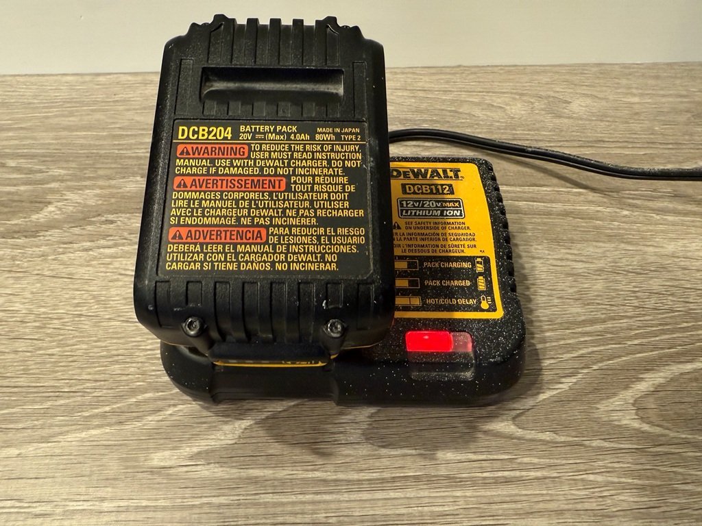 Professional diagnostic tools arranged on a workbench for Dewalt battery charger troubleshooting questions.