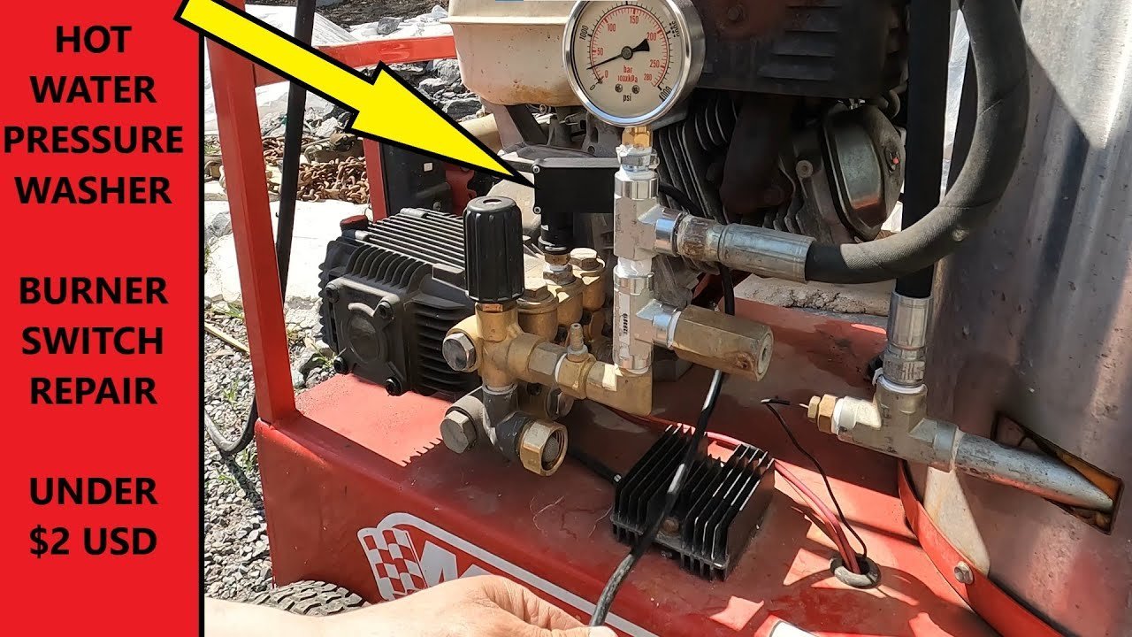 An organized display of various power washer nozzles and accessories on concrete.