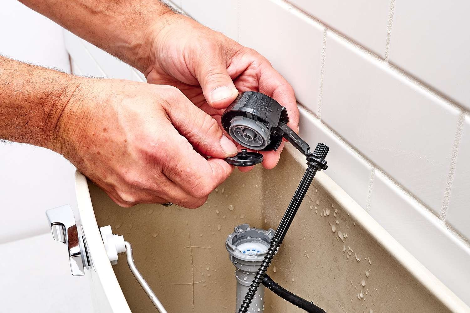Replacing a damaged toilet fill valve with a new Fluidmaster unit.