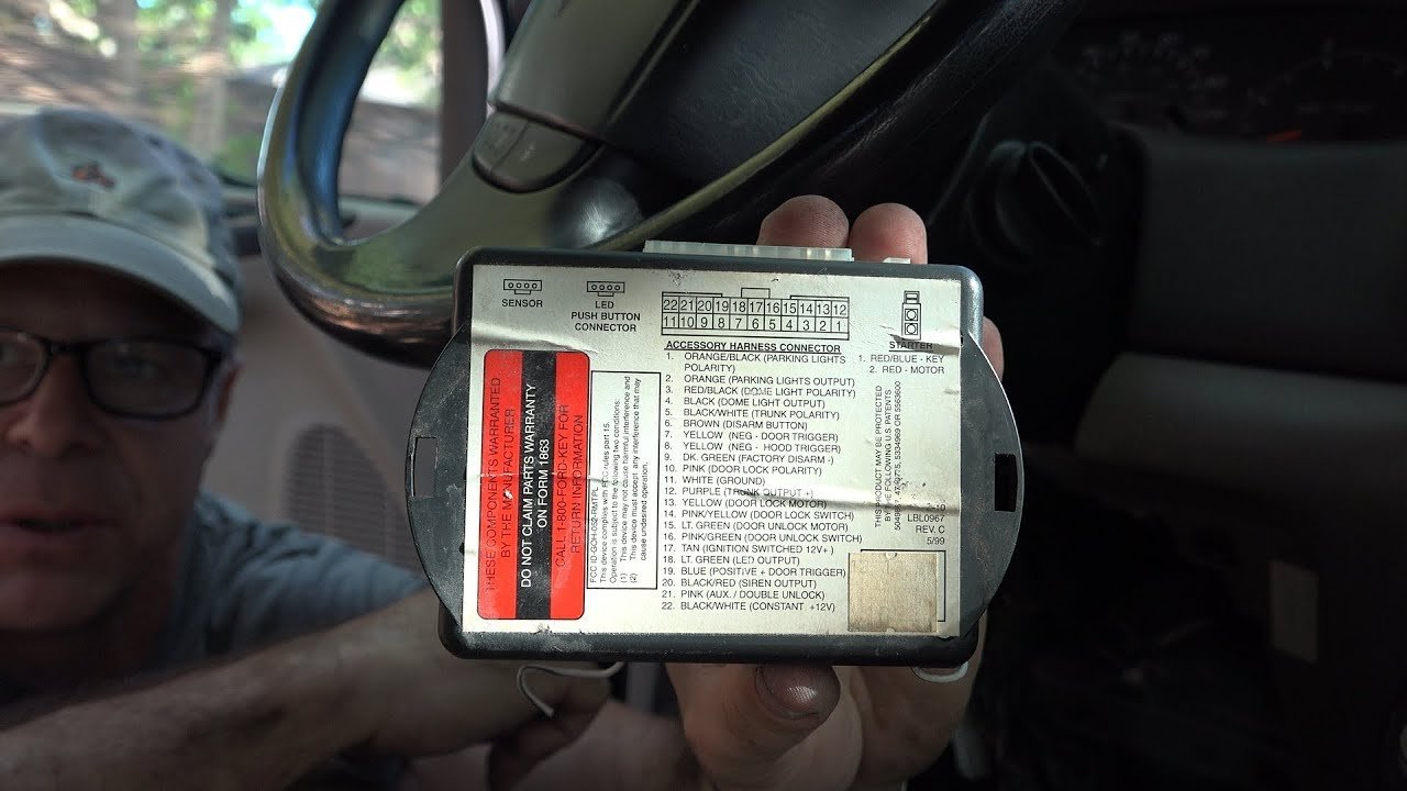 A car battery and engine bay components showing potential causes for Ford anti theft system troubleshooting.