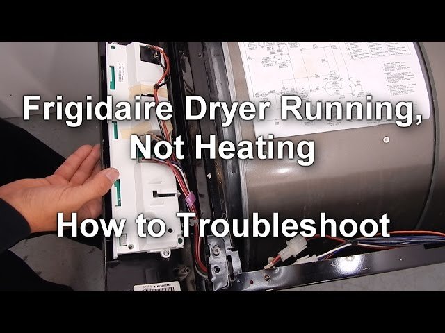 Hand disconnecting a power plug from a wall outlet to reset a laundry dryer.