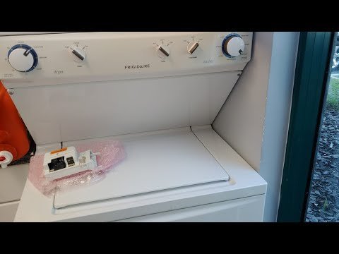 Soft folded towels on a modern dryer representing frequently asked questions about laundry maintenance.