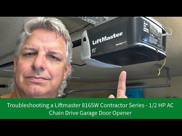 A clean residential garage space featuring a modern Liftmaster garage door system.