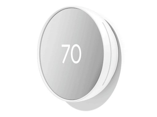 A smart thermostat mounted on an interior wall in a modern, well-lit home.