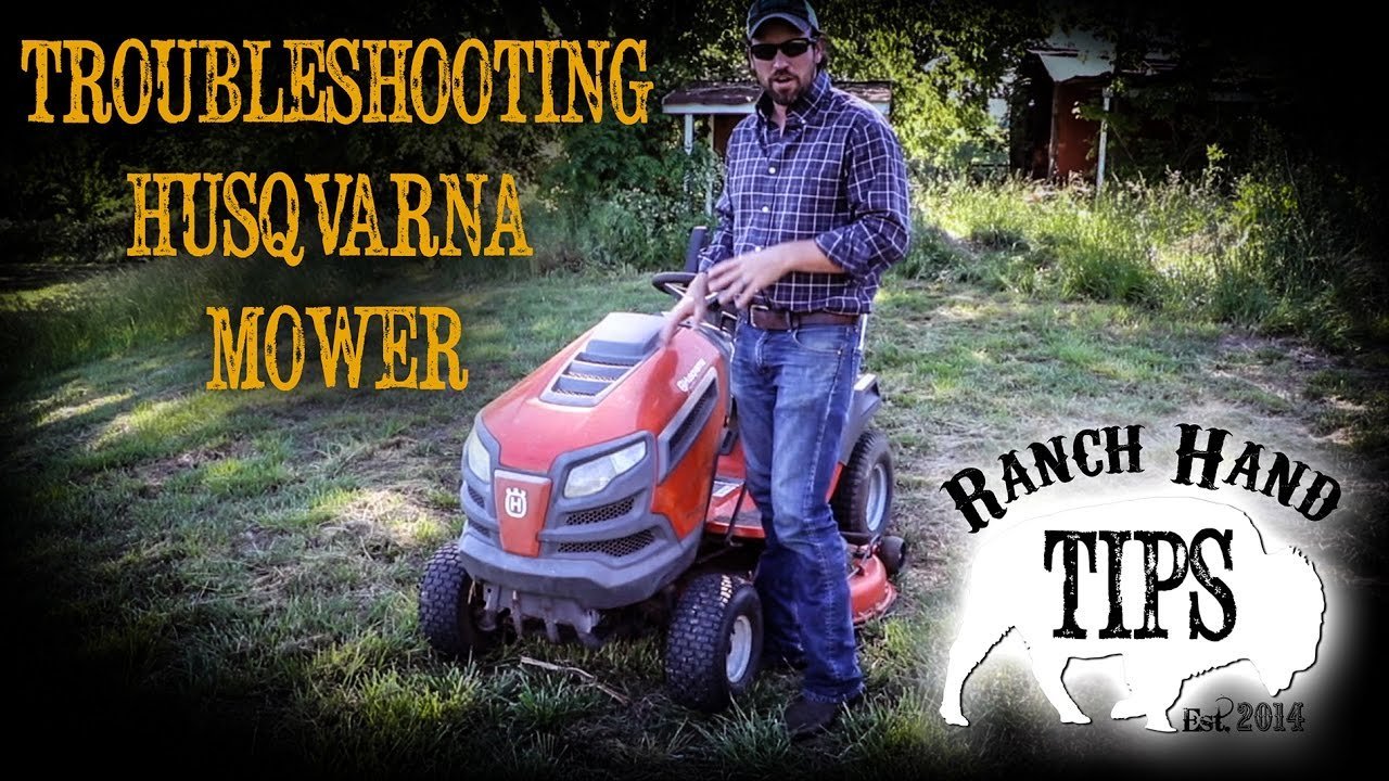 A mower owner's manual and tools are ready for answering frequently asked mower questions.