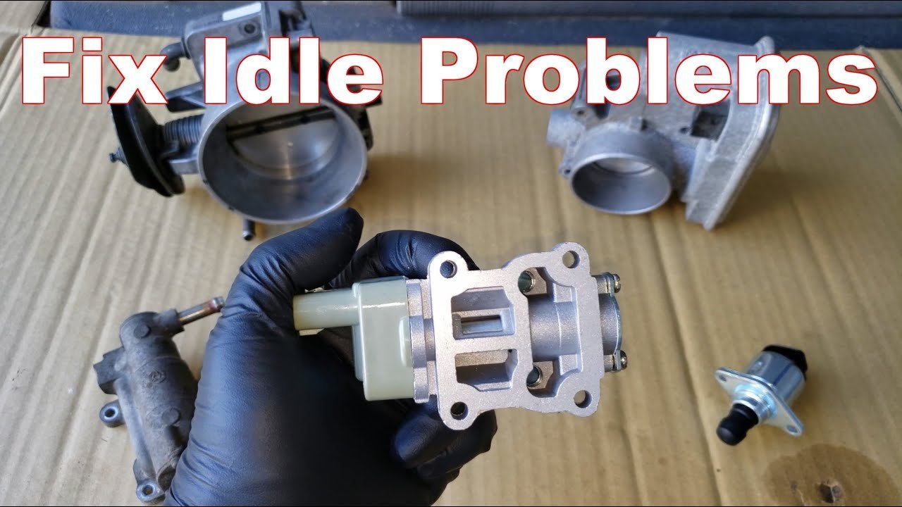 An idle air control valve installed within a modern vehicle engine bay.