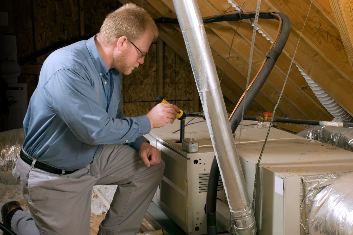 A person reviewing troubleshooting information for a Lennox heating system on a tablet.