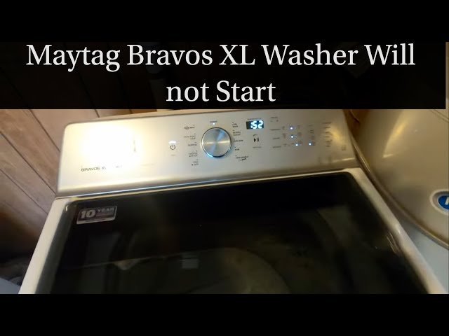A modern top-load Maytag Bravos XL washing machine sits in a clean laundry room.