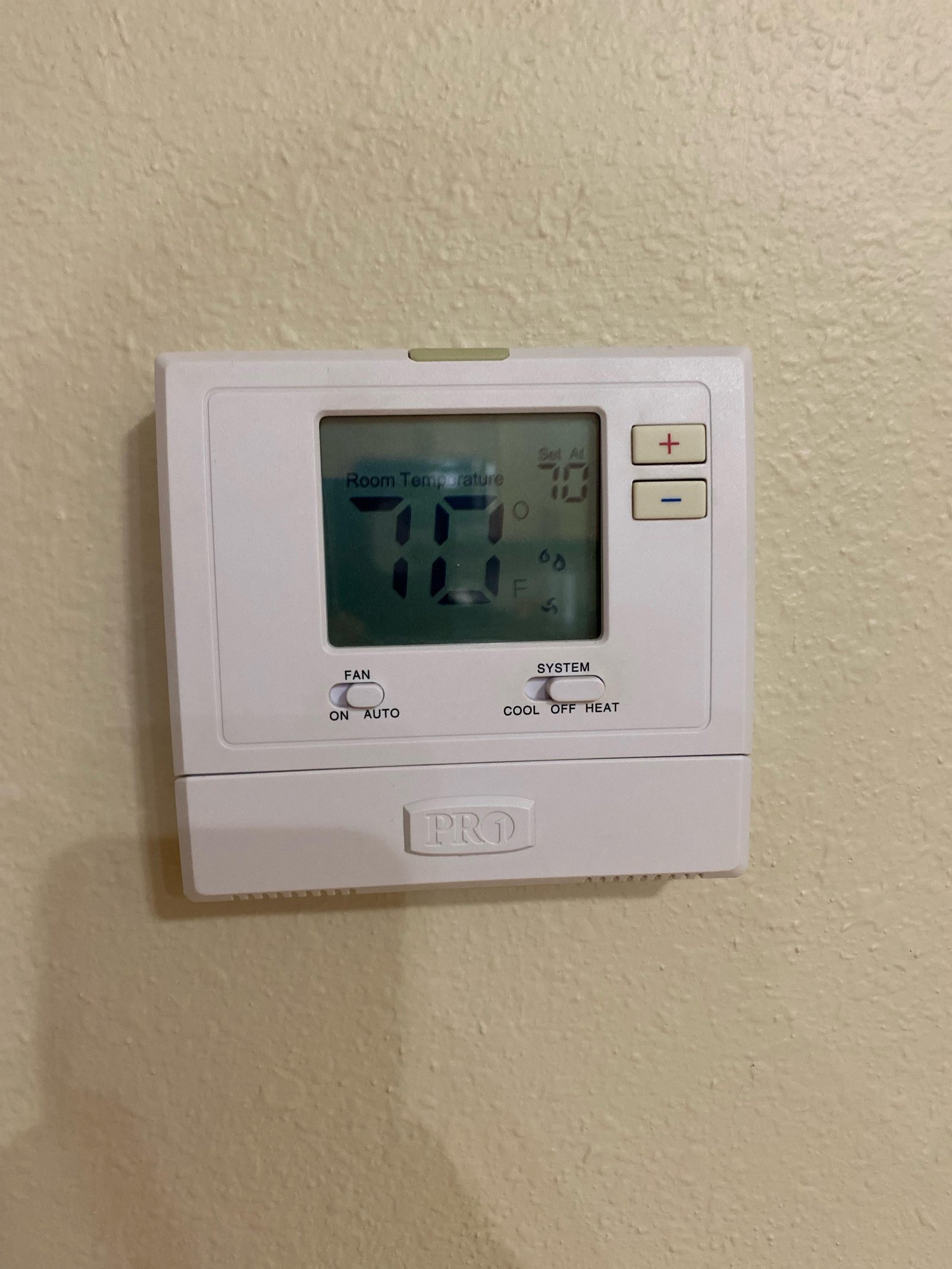 A clean workspace with a thermostat and guides for troubleshooting common issues.