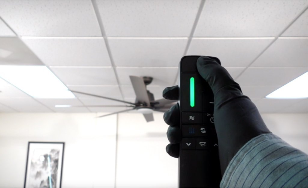 Tools and a tablet showing frequently asked questions for ceiling fan remote repair.