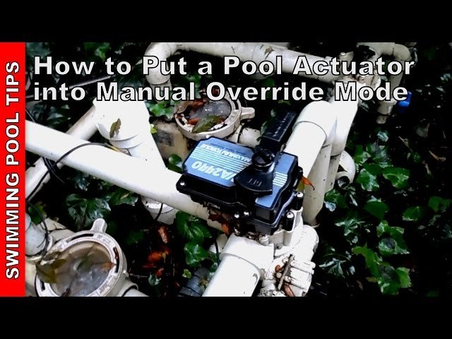 A technician performing maintenance on a Pentair valve actuator for pool plumbing systems.