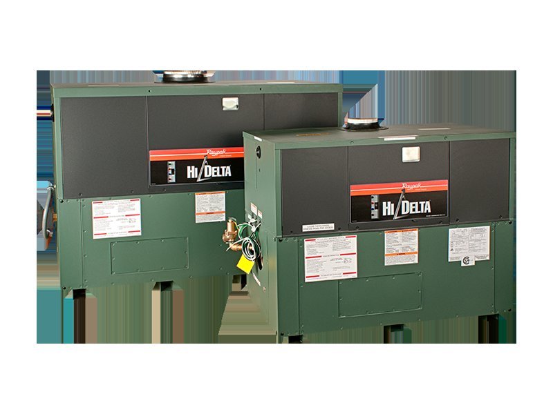 A technician performing maintenance on a modern Raypak Hi Delta industrial boiler system.