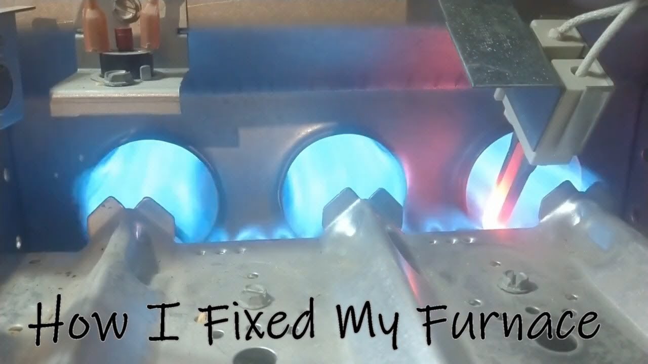 The condensate trap of a furnace showing sediment buildup that requires inspection and cleaning.
