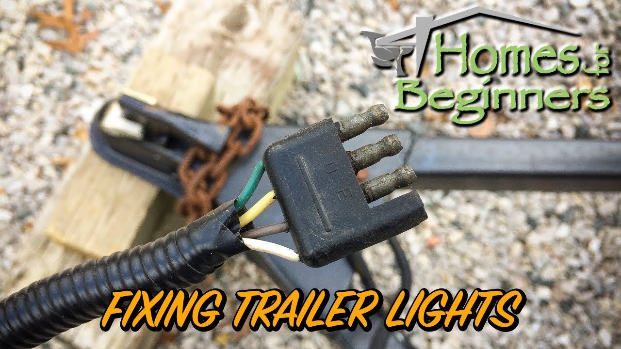 A rusted trailer electrical connector sits on a workbench during trailer light problems troubleshooting.