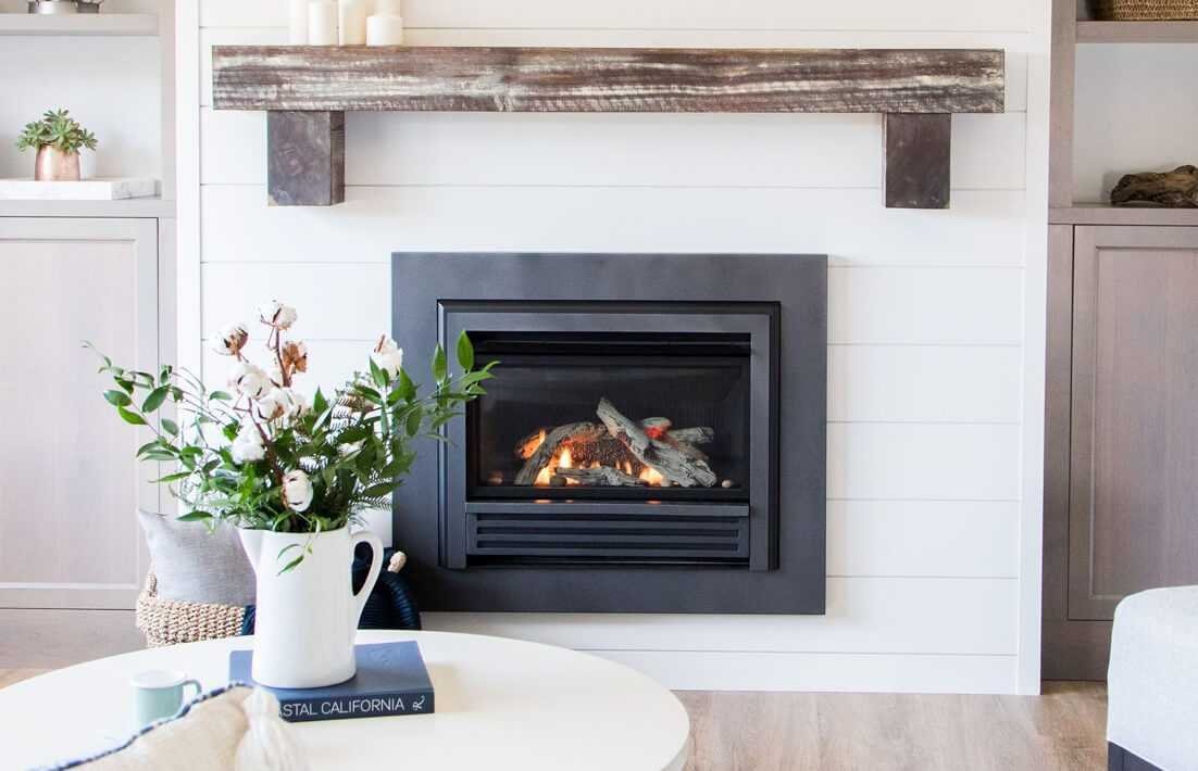 A modern Valor fireplace provides a warm and inviting glow in a contemporary living room.