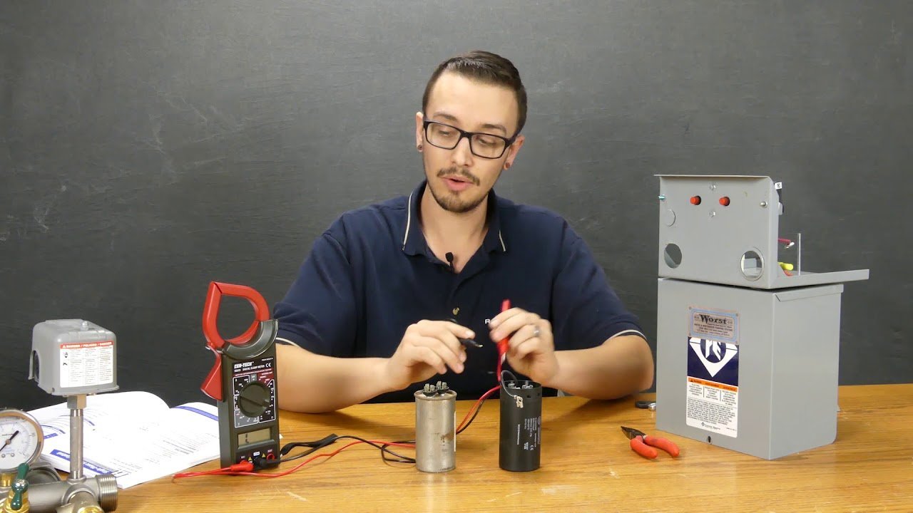An open well pump control box showing internal electrical wiring and components.