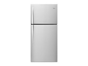 Repair manual and tools on a kitchen island for troubleshooting refrigerator issues.